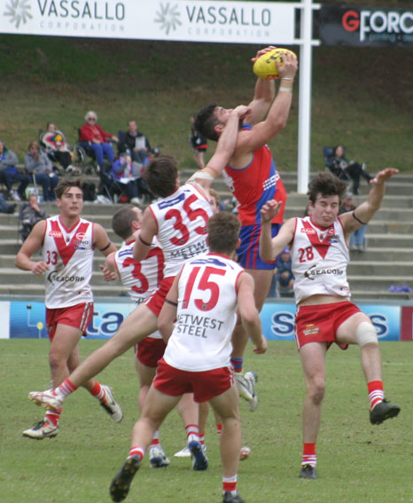UP AND ADAMS: West Perth's Marcus Adams marks in a pack of Bulldogs. Photo by Les Everett.