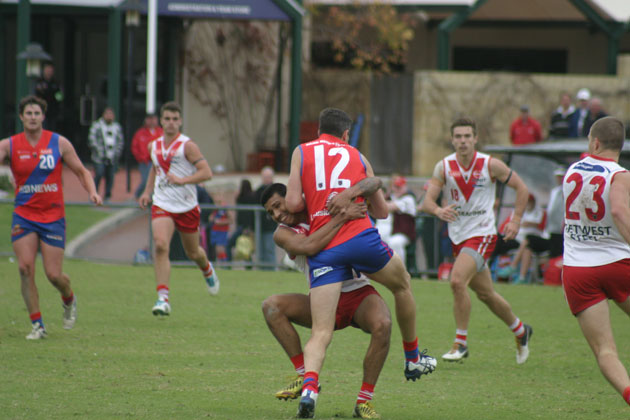 CAUGHT: West Perth's Dan Hunt runs into a Timothy Kelly tackle at Fremantle Oval. Photo by Les Everett