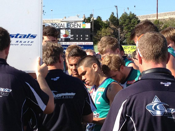 Son Son Walters listens to Peel coach Cam Shepherd at quarter time at Fremantle Oval. Photo by John Menzies