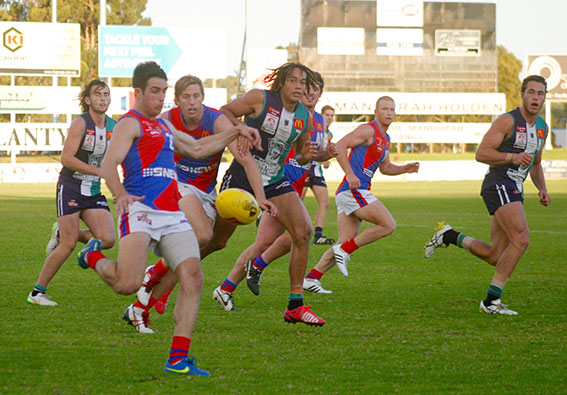 All eyes on West Perth's Kris Shannon as he drives the ball out of defence.