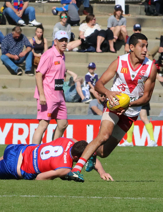 Marlion Pickett heads out of defence.